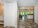 Open-concept with wood floors, vaulted ceilings, and a view of the outdoor deck at 233 Northwest Dr, Davidson, NC 28036