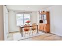Dining area with wooden table, chairs, and a china cabinet at 2554 Goose Fair Rd, Maiden, NC 28650