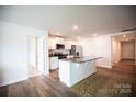Modern kitchen with white cabinets, stainless steel appliances, and a granite-topped island at 2554 Goose Fair Rd, Maiden, NC 28650