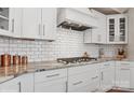 Close up of the kitchen with white cabinetry and subway tile backsplash at 3006 Portico Pl # 37, Fort Mill, SC 29715