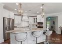 Gourmet kitchen featuring a large island, stainless steel appliances, and pendant lighting at 3006 Portico Pl # 37, Fort Mill, SC 29715
