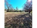 Large residential lot featuring an open meadow and mature trees offering lots of potential at 3114 Ansonville Rd, Marshville, NC 28103