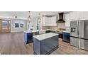 Modern kitchen boasts white countertops, a central island, and stainless steel appliances at 32507 Buchanan Ln, Albemarle, NC 28001