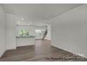 Open-concept living room with modern floors, recessed lighting, and staircase at 5149 Tommy Ln # 1102, Stanley, NC 28164