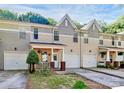 Charming exterior view of the townhouses showing front porches and well-manicured lawns at 5943 Pisgah Way, Charlotte, NC 28217