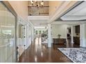 Elegant foyer with hardwood floors, staircase, and open floor plan at 9825 Ardrey Woods Dr, Charlotte, NC 28277