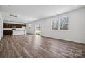 Bright living room with hardwood floors, natural light, and sliding glass door at 1117 Hallman Branch Ln, Lincolnton, NC 28092
