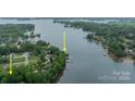 Stunning aerial view showcasing a waterfront property with private dock access on a picturesque lake at 134 Lawrence Tee Ln, Mooresville, NC 28117