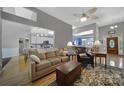 Bright open living room showcasing hardwood floors and seamless flow into modern kitchen at 160 Fernbrook Dr, Mooresville, NC 28117