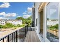 Relaxing balcony with black metal railing and an open view, perfect for enjoying the outdoors at 2907 W Trade St, Charlotte, NC 28208