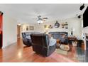 Spacious living room with hardwood floors, a ceiling fan, and comfortable seating, creating a relaxing atmosphere at 544 Cool Creek Dr, Rock Hill, SC 29732
