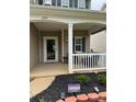 Inviting front porch with a covered entrance, offering a cozy outdoor seating area at 6509 Ridgeview Commons Dr, Charlotte, NC 28269