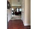 Inviting entryway leading to a spacious living room with hardwood floors and ample natural light at 6509 Ridgeview Commons Dr, Charlotte, NC 28269