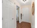 Entry hallway with wood flooring, white doors and a view to the outside at 108 Pier 33 Dr # 414, Mooresville, NC 28117