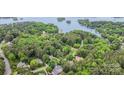 Stunning aerial view of a lakeside community surrounded by lush greenery and beautiful blue waters at 118 Sunrise Cir, Mooresville, NC 28117