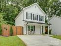 Well-maintained home featuring a modern design and manicured lawn at 1209 Gaston Ave, Gastonia, NC 28052