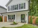 Inviting front porch with stylish seating and classic architectural details at 1209 Gaston Ave, Gastonia, NC 28052