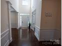 Inviting foyer with soaring ceilings, hardwood floors, and elegant trim work at 126 W Warfield Dr, Mooresville, NC 28115