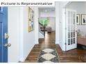 Inviting entryway with hardwood floors and view into the home's living spaces at 1361 Secrest Commons Dr, Monroe, NC 28112