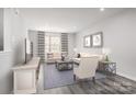 Cozy living room with neutral decor, plush seating, and large windows at 1430 Samuel St, Charlotte, NC 28206