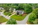 A beautiful, lush green lawn surrounds this well-maintained traditional home in a neighborhood setting at 19523 Sunnypoint Ct, Cornelius, NC 28031