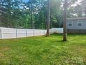 Expansive fenced backyard offers privacy and ample space for outdoor activities at 2025 Kisatchie Dr, Hickory Grove, SC 29717
