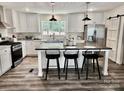 Bright, modern kitchen featuring a center island and stainless steel appliances at 2025 Kisatchie Dr, Hickory Grove, SC 29717