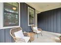 Inviting front porch with cozy seating and stylish decor, perfect for relaxing outdoors at 2637 Springway Dr, Charlotte, NC 28205