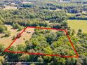 Aerial view of tree-covered land that shows expansive property boundaries, perfect for building at 290 Glenmere Ln, Mooresville, NC 28115