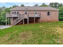 Expansive backyard with a large, multi-level wooden deck perfect for outdoor entertaining at 332 E Rebound Rd, Lancaster, SC 29720