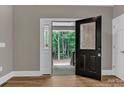 Welcoming entryway with decorative glass door that provides view to wooded front yard at 332 E Rebound Rd, Lancaster, SC 29720