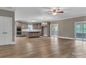 Open concept kitchen with gray cabinets, large island, stainless appliances and abundant light at 332 E Rebound Rd, Lancaster, SC 29720