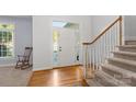 Bright foyer with hardwood floors, staircase, and natural light at 3340 Blue Jay Pass, Fort Mill, SC 29708