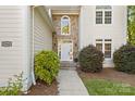Close-up of the stone front entryway featuring a white front door at 3340 Blue Jay Pass, Fort Mill, SC 29708