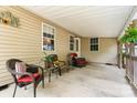 Relaxing covered porch with comfortable seating, offering an inviting outdoor space at 3690 Birchwood Ln, Denver, NC 28037