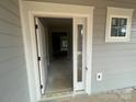 View through the open front door to the interior showcasing the light gray walls, trim and transom window at 4021 Grommet Ct # 4, Matthews, NC 28105