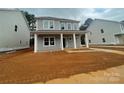 Charming two-story home featuring a welcoming front porch with classic white columns at 4021 Grommet Ct # 4, Matthews, NC 28105