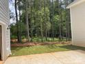Picture of a private backyard surrounded by mature trees offering a serene outdoor space at 4021 Grommet Ct, Matthews, NC 28105