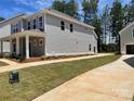 Two-story home displaying meticulous landscaping and a well-maintained lawn at 4021 Grommet Ct, Matthews, NC 28105