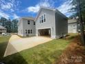 Detached two car garage with a long concrete driveway and ample parking space at 4021 Grommet Ct, Matthews, NC 28105
