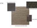 A collection of exterior samples showing the color and material choices for the house's roof, siding, and front door at 4029 Grommet Ct # 6, Matthews, NC 28105
