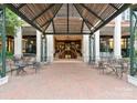 Elegant entrance featuring brick pavers, architectural overhang, and seating area at 435 S Tryon St # 601, Charlotte, NC 28202
