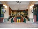 Impressive lobby entrance with dual staircases, stylish lighting, and elegant design at 435 S Tryon St # 601, Charlotte, NC 28202