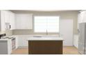 Bright kitchen with white cabinetry, stainless appliances, and center island at 6203 Flay Rd, Cherryville, NC 28021