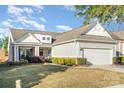 Charming home with a two-car garage, manicured landscaping, and a welcoming front porch at 8033 Pawleys Ct, Fort Mill, SC 29707