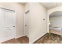 Inviting hallway featuring carpet and wood flooring, creating a warm and welcoming entrance at 8316 Highgate Dr, Charlotte, NC 28215