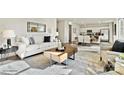 Open-concept living room with modern furnishings and a view of the dining area and kitchen at 833 Hallman Branch Ln, Lincolnton, NC 28092