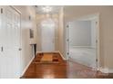 Welcoming foyer with hardwood floors and access to living spaces at 12013 Regent Ridge Ln, Charlotte, NC 28278