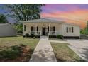 Charming home with a covered front porch, ideal for relaxing and enjoying the neighborhood at 1406 W Walnut Ave, Gastonia, NC 28052