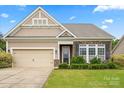 Lovely one-story home featuring a lush green lawn and brick accents, providing a warm and inviting welcome at 1409 Tupelo Rd, Clover, SC 29710